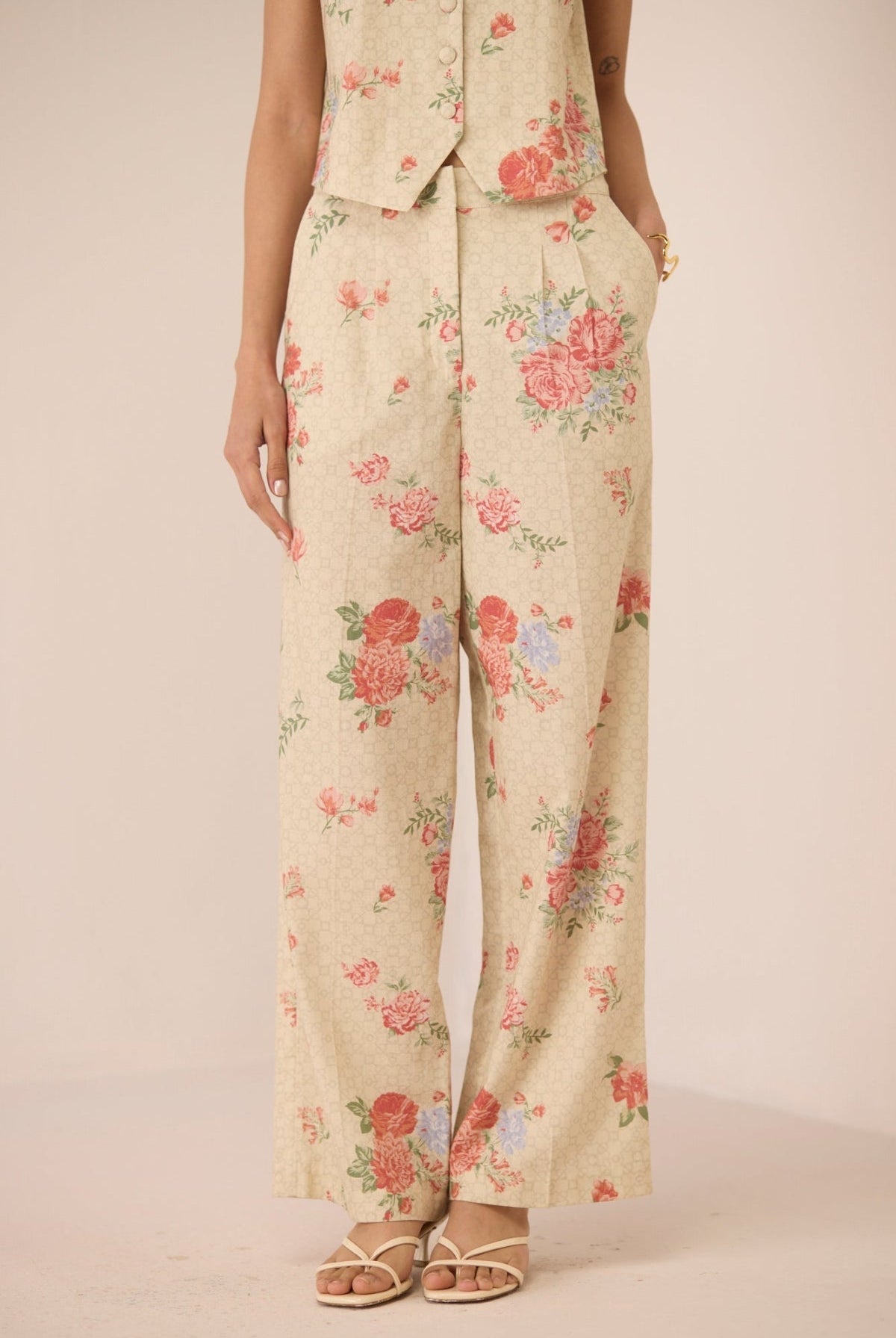 Floral patterned pants on a plain background Calling June