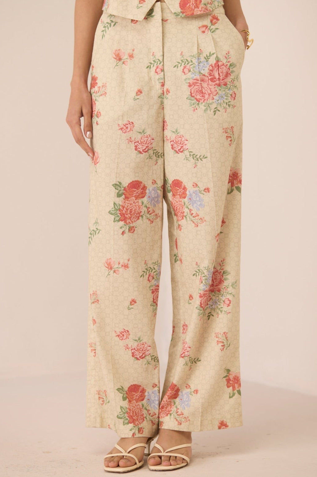Floral patterned pants on a plain background Calling June