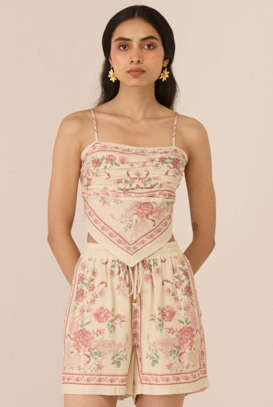 Woman wearing a floral dress with a plain background Calling June