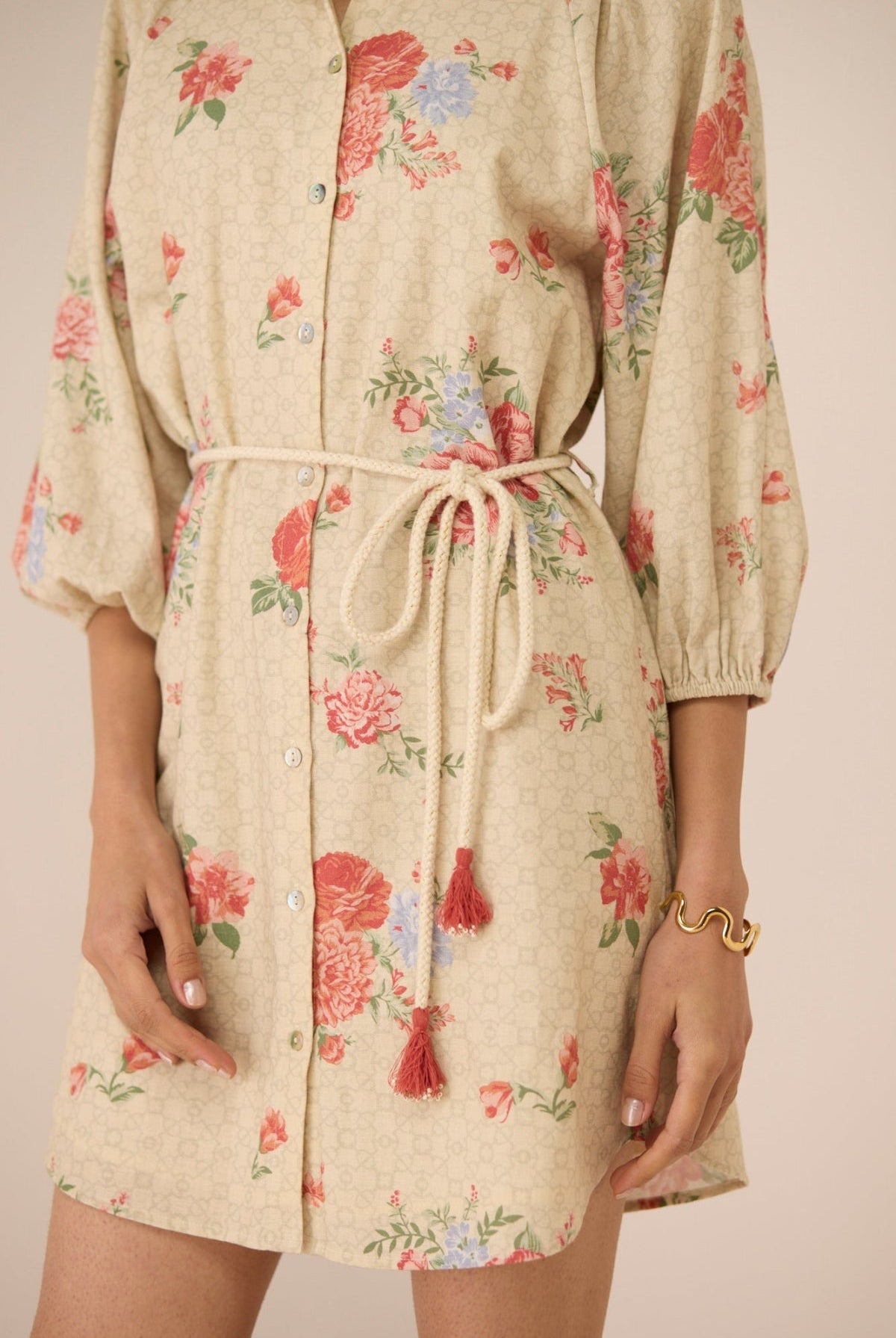 Beige floral dress with a drawstring waist on a plain background Calling June