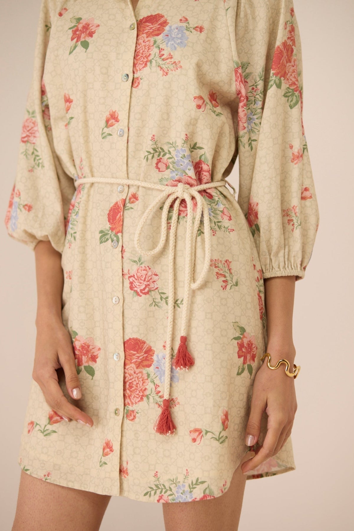 Beige floral dress with a drawstring waist on a plain background Calling June