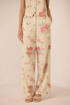 Floral patterned pants on a plain background Calling June