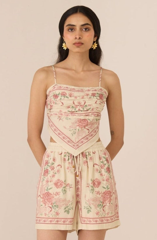 Woman wearing a floral dress with a plain background Calling June