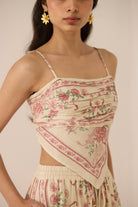 Woman wearing a floral dress with a plain background Calling June