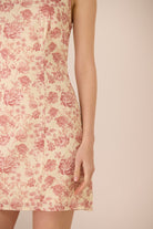 Floral dress with pink roses on a beige background Calling June