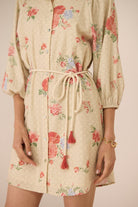 Beige floral dress with a drawstring waist on a plain background Calling June